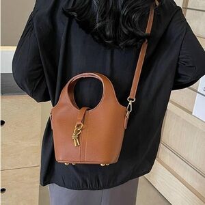 Top handle leather bucket bag with crossbody strap small size in honey brown